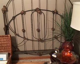 One of a pair of antique iron beds
