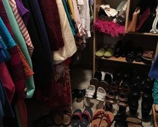 Women's closet filled with clothing and shoes