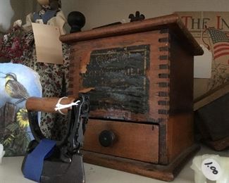 Antique coffee grinder and child's toy iron