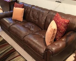 Leather couch and accent pillows
