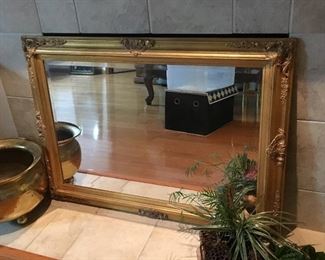 One of the large beveled mirrors