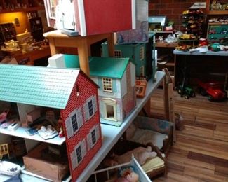 Several Doll houses and lots of doll house furniture