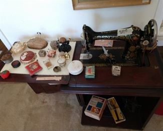 Antique sewing machine in cabinet