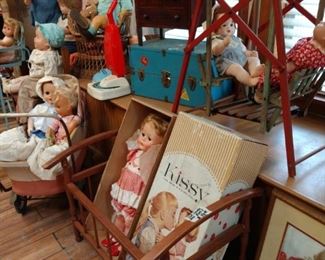 Dolls in boxes and doll swinging