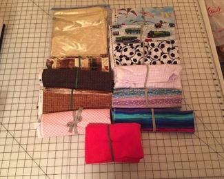 Small fabric remnants, there is even a small piece of gold lame with matching thread...great for Cosplay.