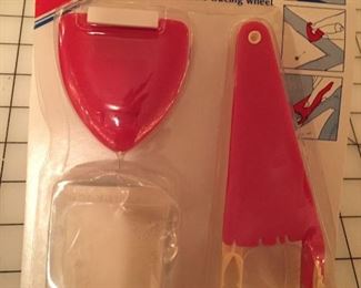 New unopened chalk fabric-marking tool kit. Includes tracing wheel, chalk marker and chalk refill. This is just a sample of many sewing notions.