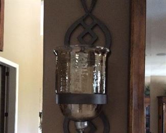 Pair of wall sconces.  Add flameless candles and your previously dull wall has personality and charm.