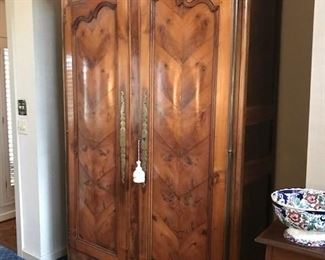 Gorgeous armoire that has been modernized inside for a tv and stereo equipment.