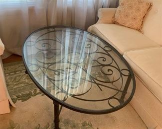 #14		Oval Metal Base Glass Top Coffee Table  48x34x15	 $60.00 
