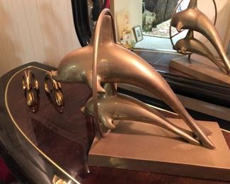 Brass dolphin sculpture