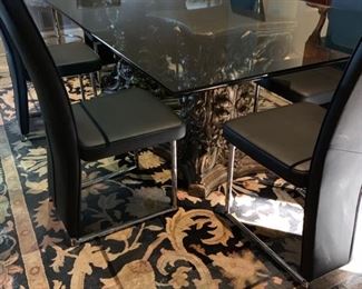 Glass top table on custom painted pedestals. 92 X 48