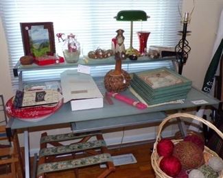 modern Desk Metal and Glass, Luggage stand , basket of Yarn, the green stack on right side is cross stitch  little girls (so cute) and misc