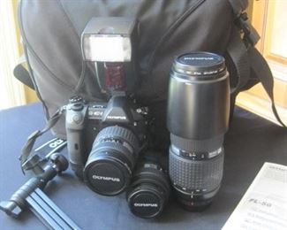 Olympus E-1 digital camera set with lenses and accessories.