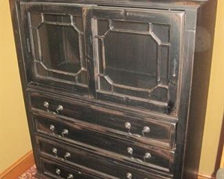 Cabinet with sliding top doors.