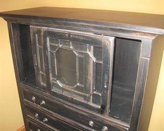 Cabinet with sliding top doors.