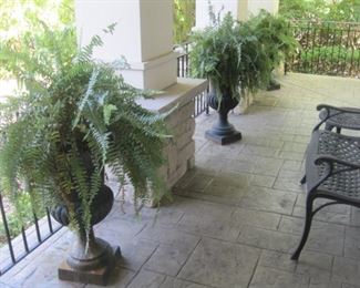 Three Cast Iron Urns.
