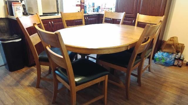 Oval Self-Storing Leaf Table with 6 Padded Chairs
