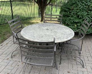 4 chairs and round "concrete" table