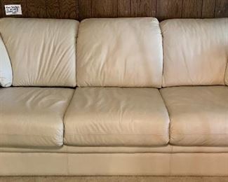 GLENN FURNITURE CO. OFF WHITE LEATHER THREE CUSHION SOFA