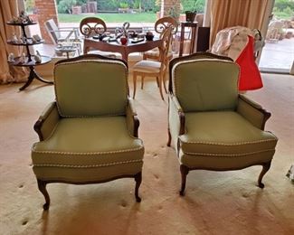 Green upholstered arm chairs