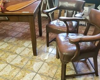 Pair of vintage leather arm chairs