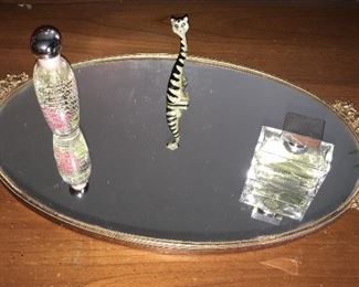 Vintage gilded mirror; various perfume bottles