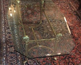 Brass ram head and hoof glass top coffee table