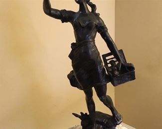 Vintage bronze statue young girl holding bird and basket