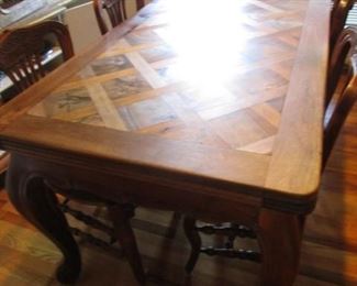 Dining table.  Seats 8.  Inlaid wood sections.