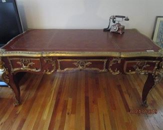 Beautiful Ornate Executive Desk. Three drawers. Brass adornments on legs, corners and drawers.
Very heavy.