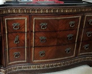 Matching bedroom dresser has lots of storage