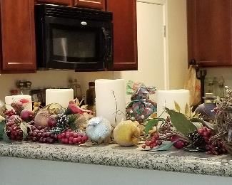 Decorative fruits and candles and florals