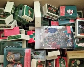 Collectible Christmas ornaments and decor still in boxes.