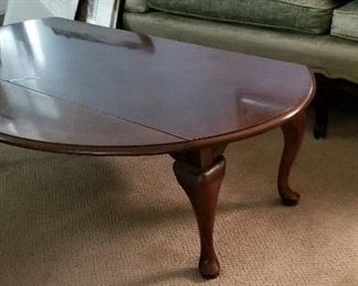 Coffee table that folds down both sides.