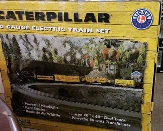 Caterpillar electric train set in box.