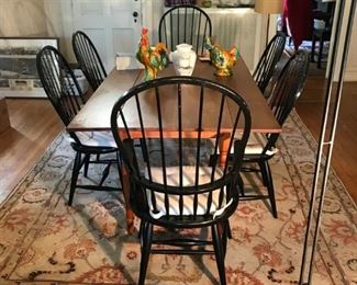 Large wooden dining room table with 6 chairs