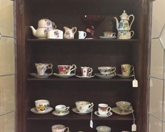 China cups & saucers in antique drop-front secretary
