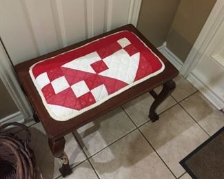 Piano stool covered with vintage quilt piece