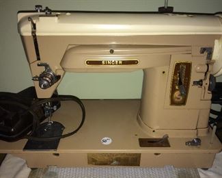 Singer sewing machine and attachments.  No. 404