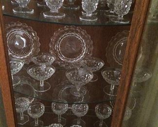 Cabinet full of American Fostoria glass ware.  Yes, they have 3 seams!