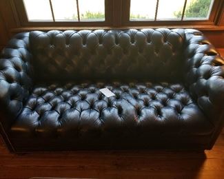 Navy leather English chesterfield it is a little lighter than this photo shows -- blue is tricky to photograph