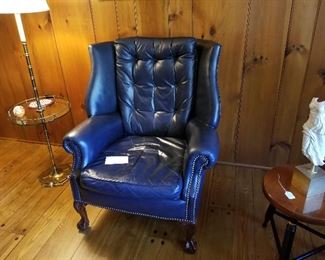 navy blue tufted leather arm chair -- it is a deeper color than this photo