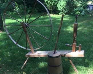 Antique spinning wheel and butter churn