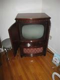 This antique Sromberg Carlson tube TV is stunning!! The Cabinet is cherry mahogany with lovely intricate detailsing on the top lip. We plugged it in and fired it up! The tube lit up, you could hear that the speaker worked- but alas there is no free TV no more- so since it is not hooked up to anything there is no picture!! Serial # 396767