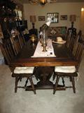 This dark wood colonial farm table w/ 8 chairs in part of the dining room set! There is also a hutch that goes with it! picture of hutch posted by Tuesday night