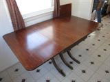 Old extended drop leaf table ( check out those legs!).  It's close to 90 years old and the top shows some wear- but the legs are sweet and the drop sides are strong and easy up and down!
