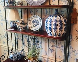 Bakers rack filled with pretty blue and white china