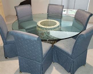 Beautiful Asian Inspired Glass Top Dining Table & Chairs. The base is a large Asian Fish Bowl on Brass stand.