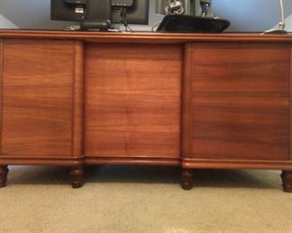 Frontal nudity shot of the vintage walnut desk.