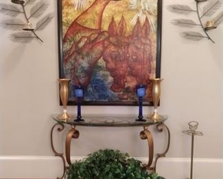 Very large art piece, oil on canvas of angel with pair of doves and pipe smoking horse, glass/brass console table, vintage brass bumbershoot holder and interesting feathery wall sconces. 